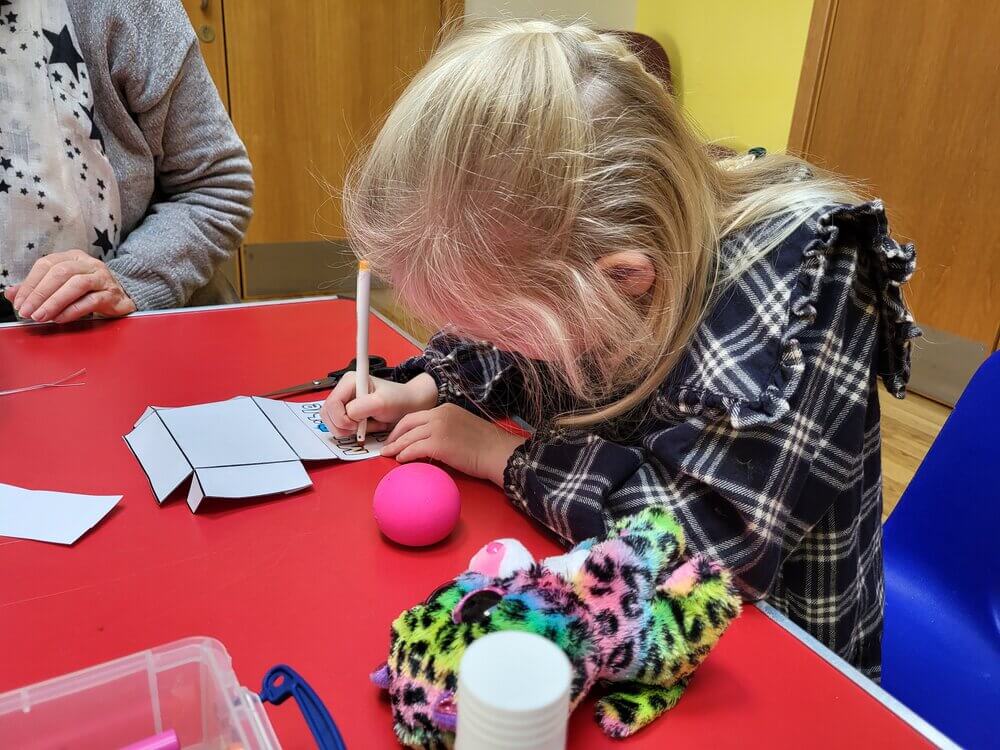 Child doing activities on a table